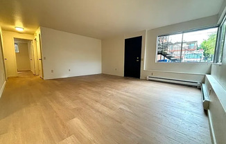2 BD/ 1 BA ground level unit in triplex. Prime Ballard location w/off-street parking!