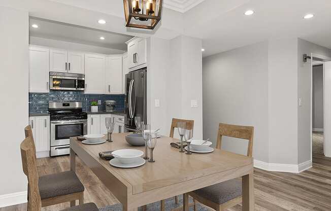 Hardwood floored dining room with view of kitchen.