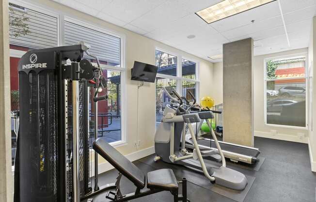 Fitness Facility with exercise equipment and windows facing outdoor view at Promenade at the Park Apartment Homes, Washington