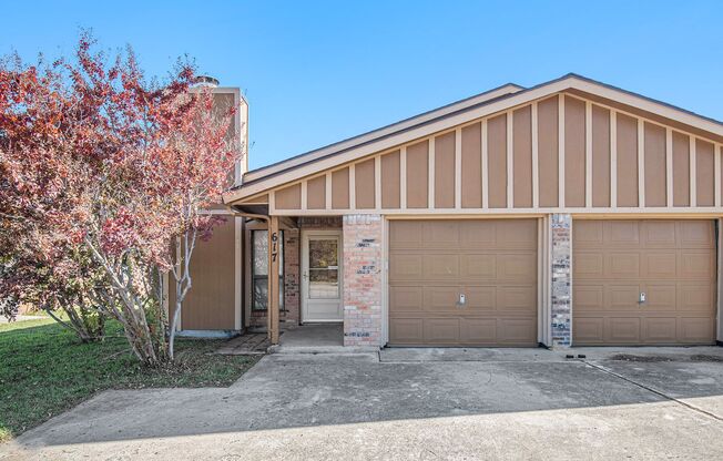 Modern duplex featuring three bedrooms and two bathrooms with an attached garage.