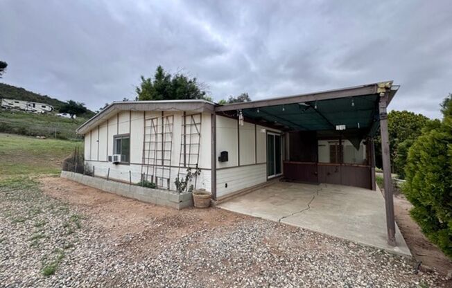 2 bedroom 2 bathroom ranch style single story home for LEASE with horse stables on site!