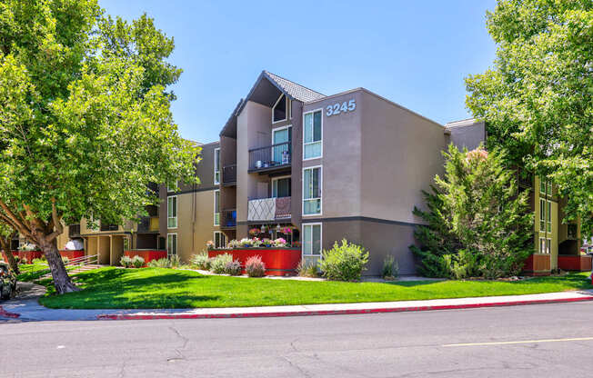 A building with the number 3245 on it is surrounded by trees and greenery.