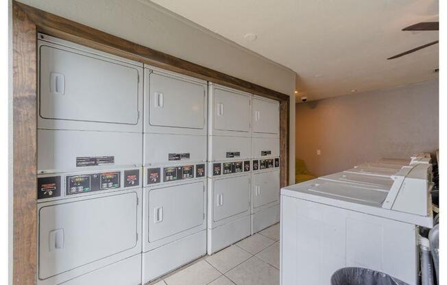 a kitchen with white cabinets and a counter top