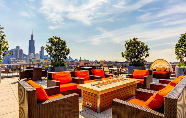 Rooftop deck with a fire pit, lounge area and skyline views at The Madison at Racine, Illinois, 60607