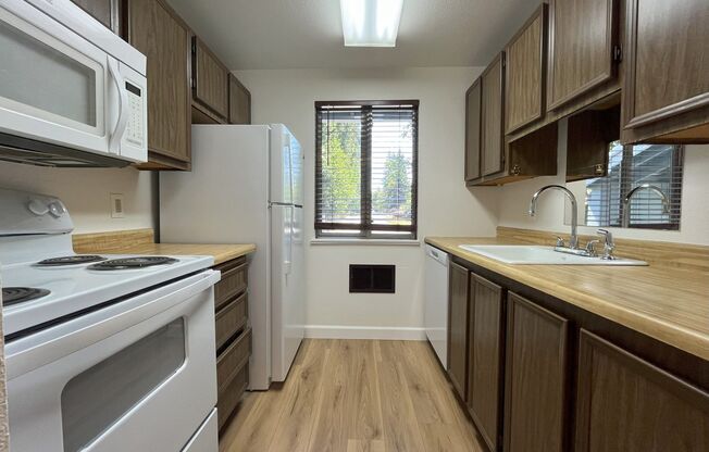 Charming Condo with Creek Views, Laminate Flooring, and Prime Location Near Washington Square!