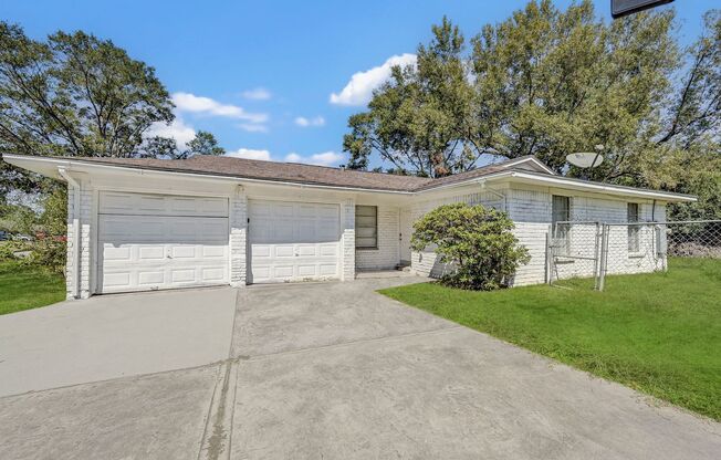 Charming white brick home with lots of upgrades nestled in the desirable neighborhood