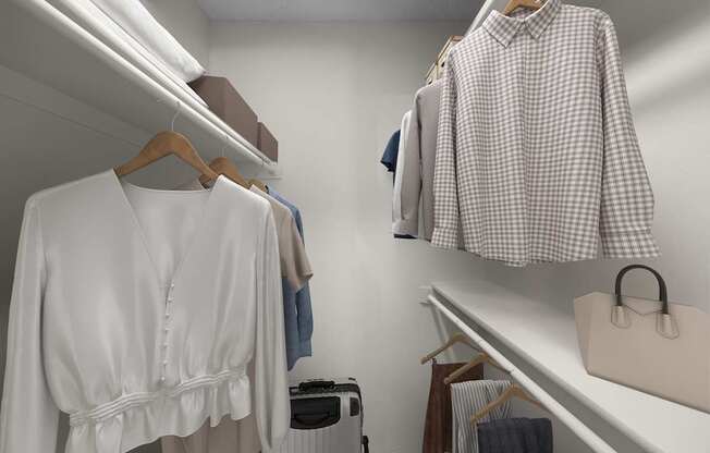 A white shirt with a belt is hanging on a hanger.