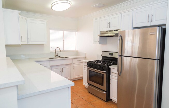 kitchen view with stove and fridge