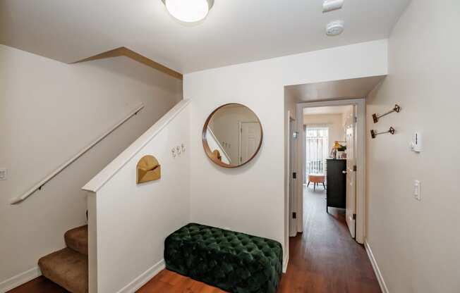 a view of the hallway from the top of the stairs