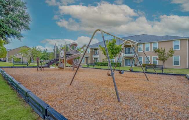playground with apartments in background