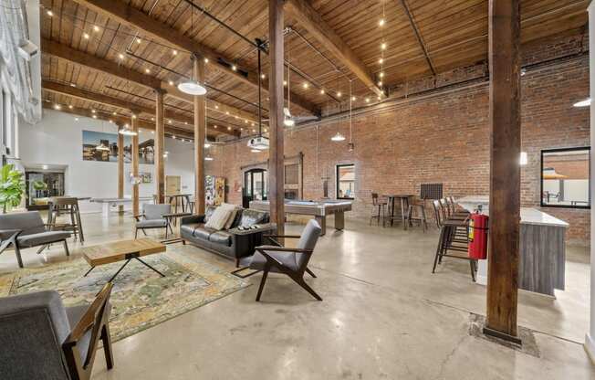 an open floor plan with a pool table and lounge area