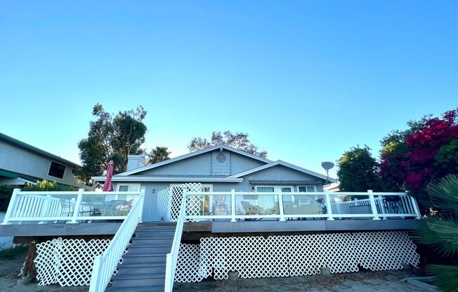 Gorgeous 3 Bed 2 Bath on the Lake with dock and large deck! MUST SEE!!