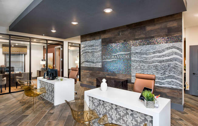 a lobby with a reception desk and chairs