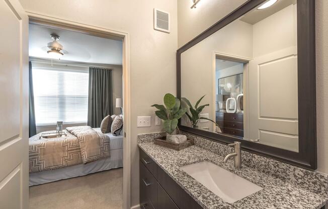 a bedroom with a large mirror