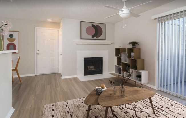 a living room with a fireplace and a ceiling fan