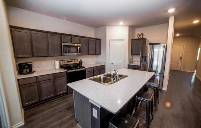 Boasts 4 bedrooms with 2 baths on a premier lot. As you enter the home, you will be greeted with an open entry way that leads to the open concept living room