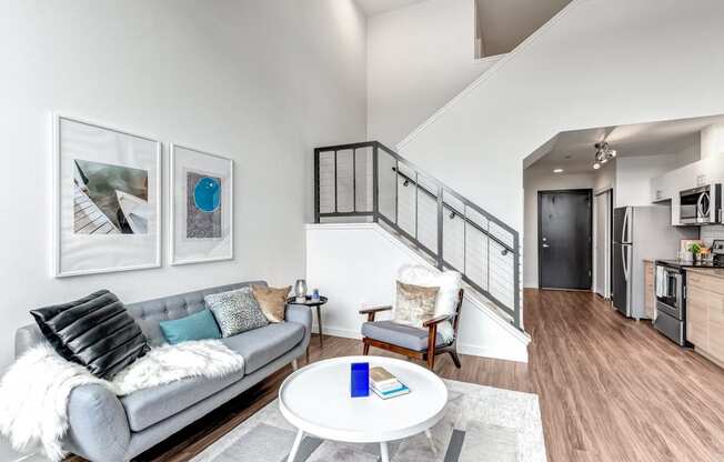 The Merc Apartments Model Living Room and Staircase