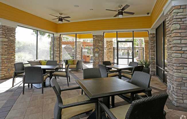 A patio with a table and chairs.