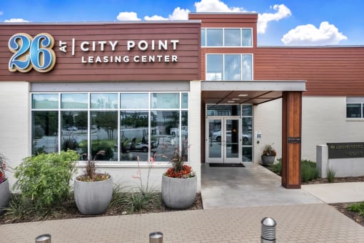 a building with a sign that reads 26 city point leasing center