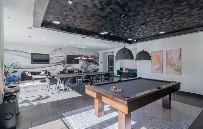 Billiards Table in an Updated Resident Clubhouse at Abstract at Design District in Dallas TX, 75207