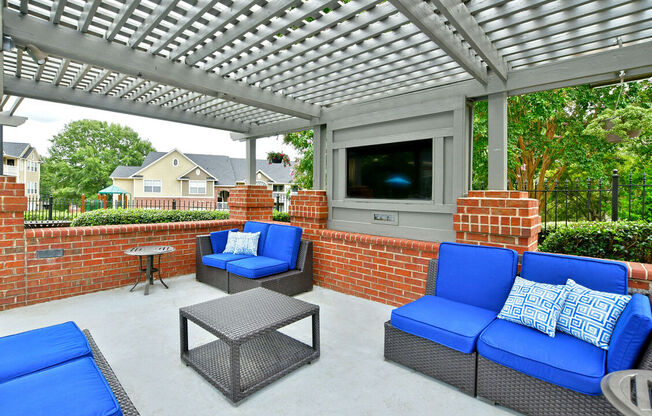 Outdoor Patio With TV at Braxton Woods Lake, Greenville