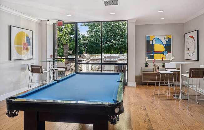 Community Clubhouse with Game Tables and Lounge Furniture at Mason Van Dorn Apartments located in Alexandria, VA.