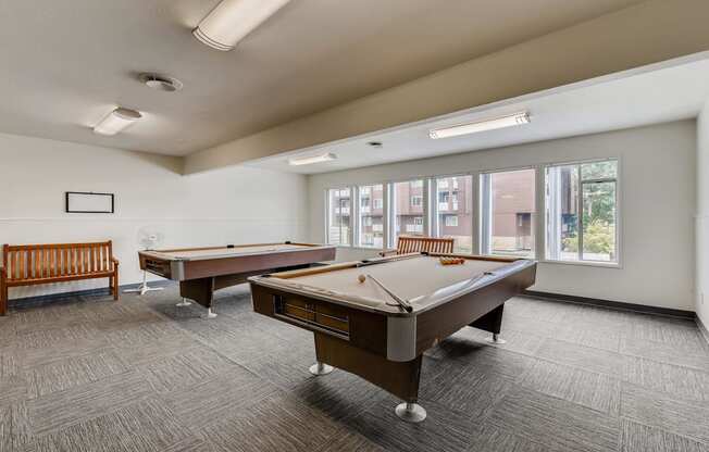 The Community Clubhouse with a Pool Table at Morningtree Park Apartments