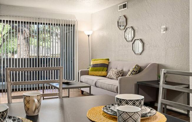 a living room with a table and a couch