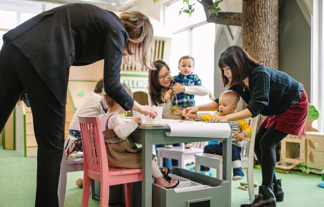Women and children playing at Bakery Living in Pittsburgh, PA 15206