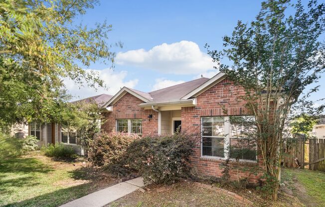Charming 3-bedroom, 2-bath single-family home with a spacious 2-car garage.