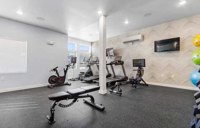 A spacious home gym with a variety of exercise equipment.
