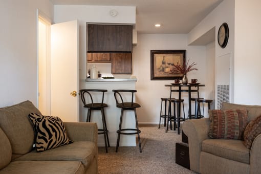 A welcoming living space with neutral tones and plush carpeting.