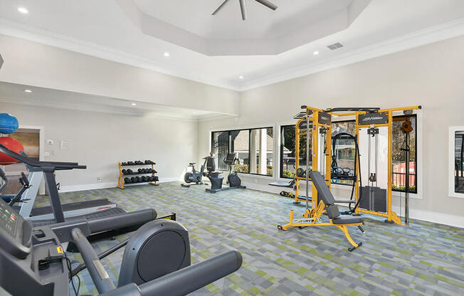 Community Fitness Center with Equipment at Shadow Ridge Apartments in Riverdale, GA.
