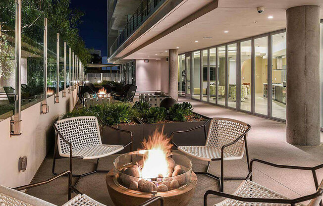 patio with glistening firepits at K1 Apartments, San Diego, CA 92101