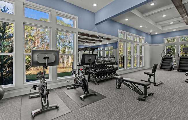 A spacious home gym with a variety of exercise equipment.