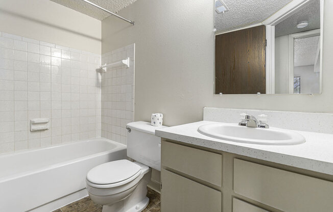 Master Bathroom with Tub/Shower Combination at Normandy Village Apartments in Michigan City, IN