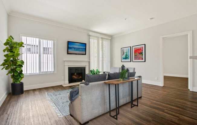 a living room with a couch and a fireplace