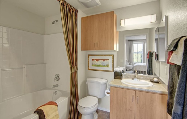 a bathroom with a toilet sink and bathtub
