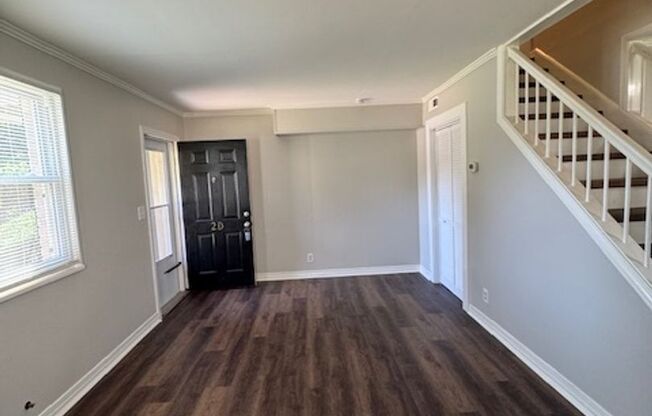 Downtown living at its best! Remodeled - 2-Story End-Unit is convenient to all that Downtown Greenville has to offer. 2 BD, 1 Full BA - freshly painted, New LVP Flooring, New Stainless Appliances