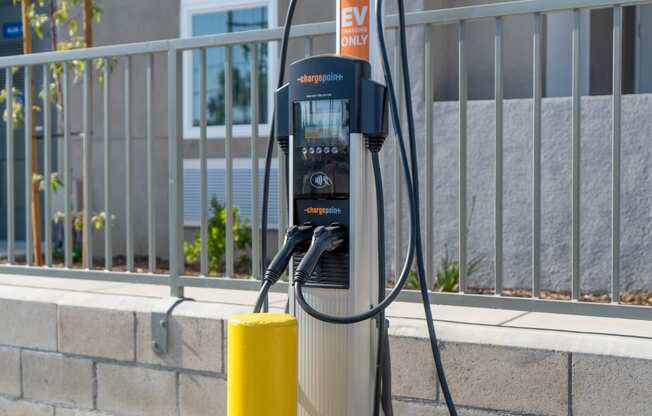 a gas pump in front of an apartment building at Loma Villas Apartments, San Bernardino