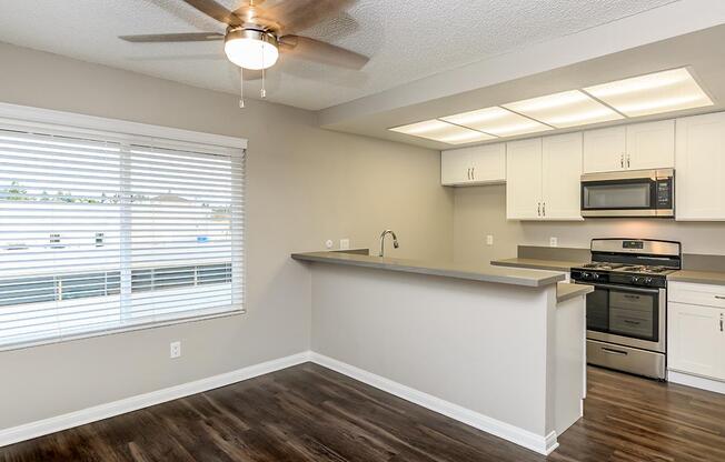 a kitchen with a large window