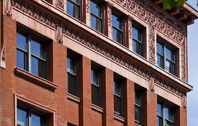 a red brick building with windows and trees