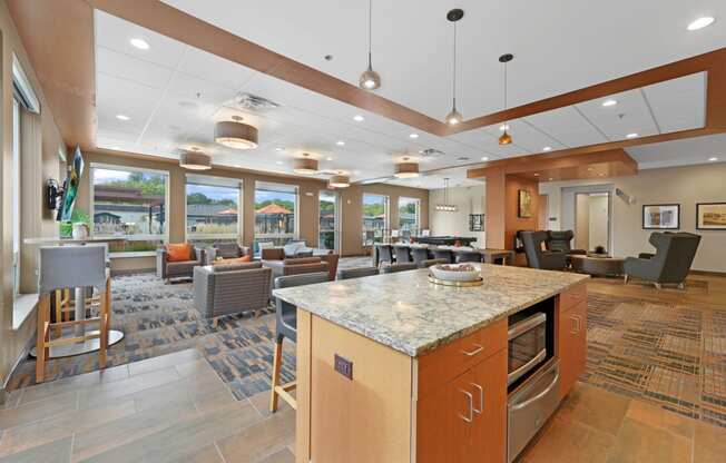 a resident clubhouse with a kitchen and lounge area