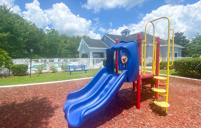 Outdoor Playground equipped with a slide, monkey bars, and latter