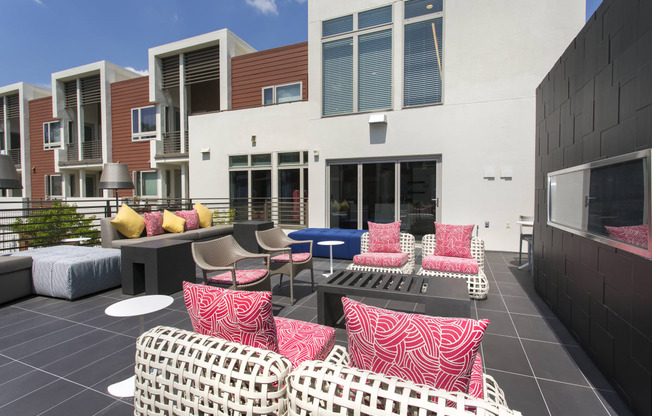 a patio with chairs and tables