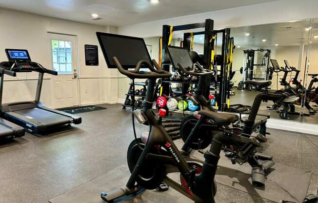 a gym full of exercise bikes and other fitness equipment