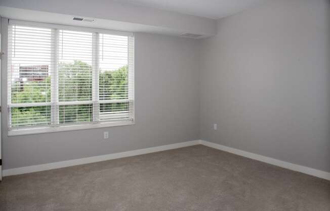 Marc floor plan bedroom with large windows at Urban Park I and II Apartments, Minnesota, 55426