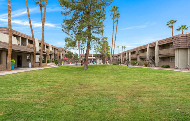 Verde Apartments buildings with grass in front. Tucson, AZ, 85719