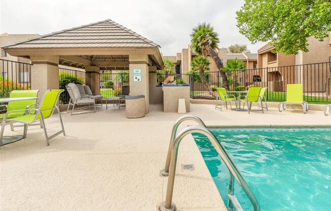 Lounging By The Pool at Cimarron Place Apartments, Arizona, 85712