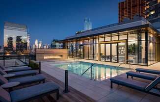 a pool in a room with a blue walled building at The Lively, New Jersey